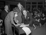 NJ State Senator C. Robert Sarcone signs a document by Ace (Armando) Alagna, 1925-2000