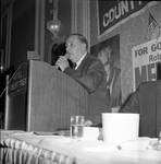 Delivering a speech at North Ward Democratic Country Commission political event at the Robert Treat Hotel, Newark NJ by Ace (Armando) Alagna, 1925-2000