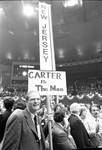 Brendan Byrne holds a 'New Jersey, Carter is our man sign on the convention floor at the 1976 Democratic National Convention in New York City by Ace (Armando) Alagna, 1925-2000