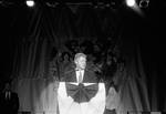 President Bill Clinton speaks at a dinner by Ace (Armando) Alagna, 1925-2000