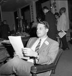 NJ State Assembly member Philip Kaltenbacher reads a document by Ace (Armando) Alagna, 1925-2000