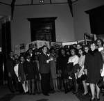 NJ State Assemblyman Ralph Caputo standing with a group of school aged youth by Ace (Armando) Alagna, 1925-2000