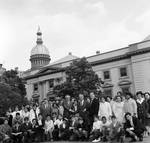 NJ State Assemblyman Ralph Caputo and other assemblymen posing with a group of schoolchildren for a picture outside the State Capitol building by Ace (Armando) Alagna, 1925-2000