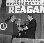 President Ronald Reagan being presented with the Columbus Award by Ace (Armando) Alagna, 1925-2000