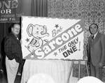 Robert Sarcone stands by his poster for the gubernatorial race by Ace (Armando) Alagna, 1925-2000