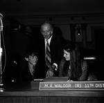 New Jersey State Senator Waldor and family in the Senate Chambers by Ace (Armando) Alagna, 1925-2000