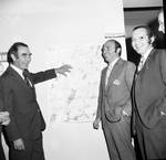 Senator Williams and campaign team in front of map by Ace (Armando) Alagna, 1925-2000