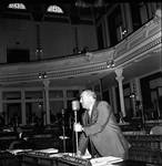 NJ State Assembly member Herbert J. Heilmann speaks on the Assembly floor by Ace (Armando) Alagna, 1925-2000