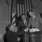 NJ state assembly speaker Frederick Hausser shakes hands by Ace (Armando) Alagna, 1925-2000