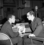 NJ State Assembly member (later Chief Justice) Robert Wilentz speaks with another legislator by Ace (Armando) Alagna, 1925-2000