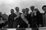 Ace Alagna, Brendan Byrne, Peter W. Rodino and others stand on the dais during the 1974 Columbus Day Parade by Ace (Armando) Alagna, 1925-2000