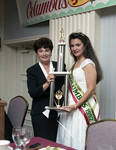 Miss Columbus Day 1992 is presented with her trophy by Ace (Armando) Alagna, 1925-2000